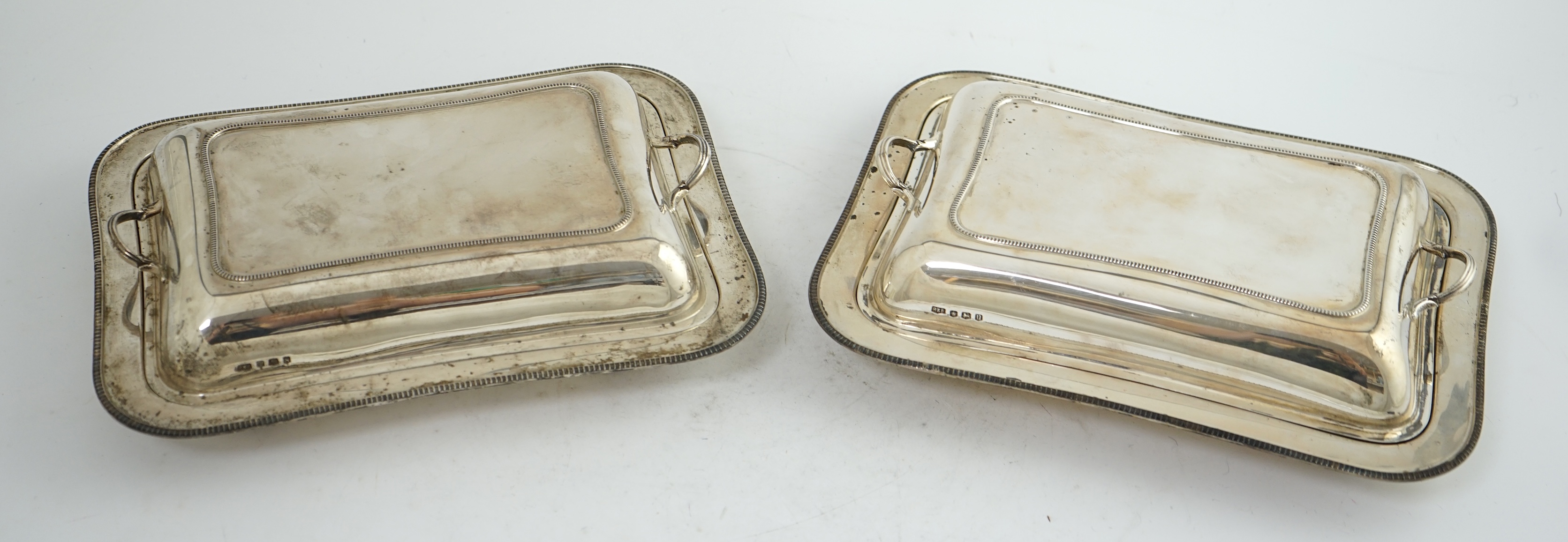 A pair of 1930's silver entrée dishes and covers, by Roberts & Belk